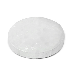 Round white marble stone on a white background