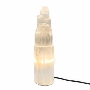 Decorative lamp made of selenite stone on a white background